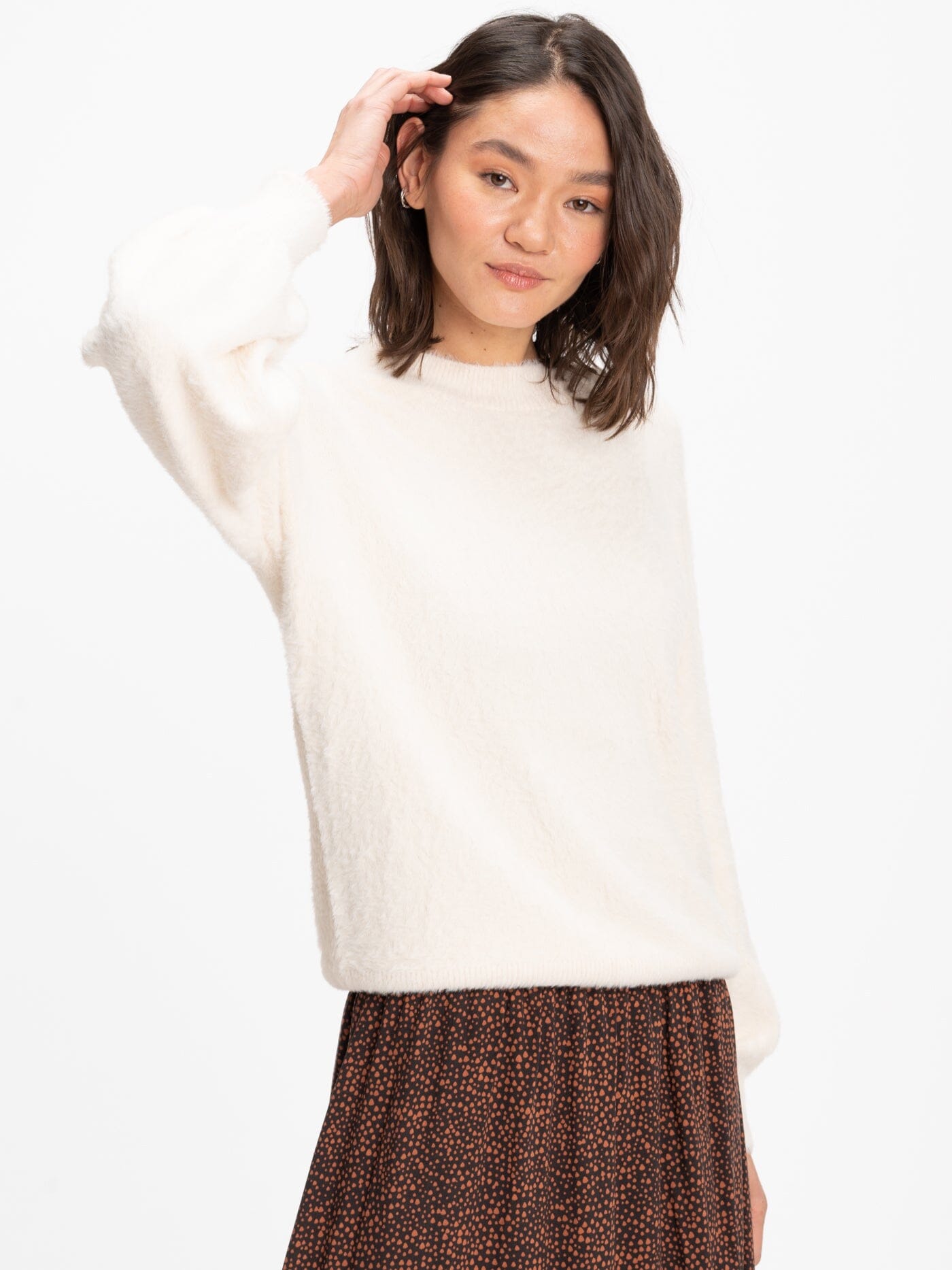 Clara Fuzzy Pullover Crew Neck Sweater in a soft, textured knit fabric.