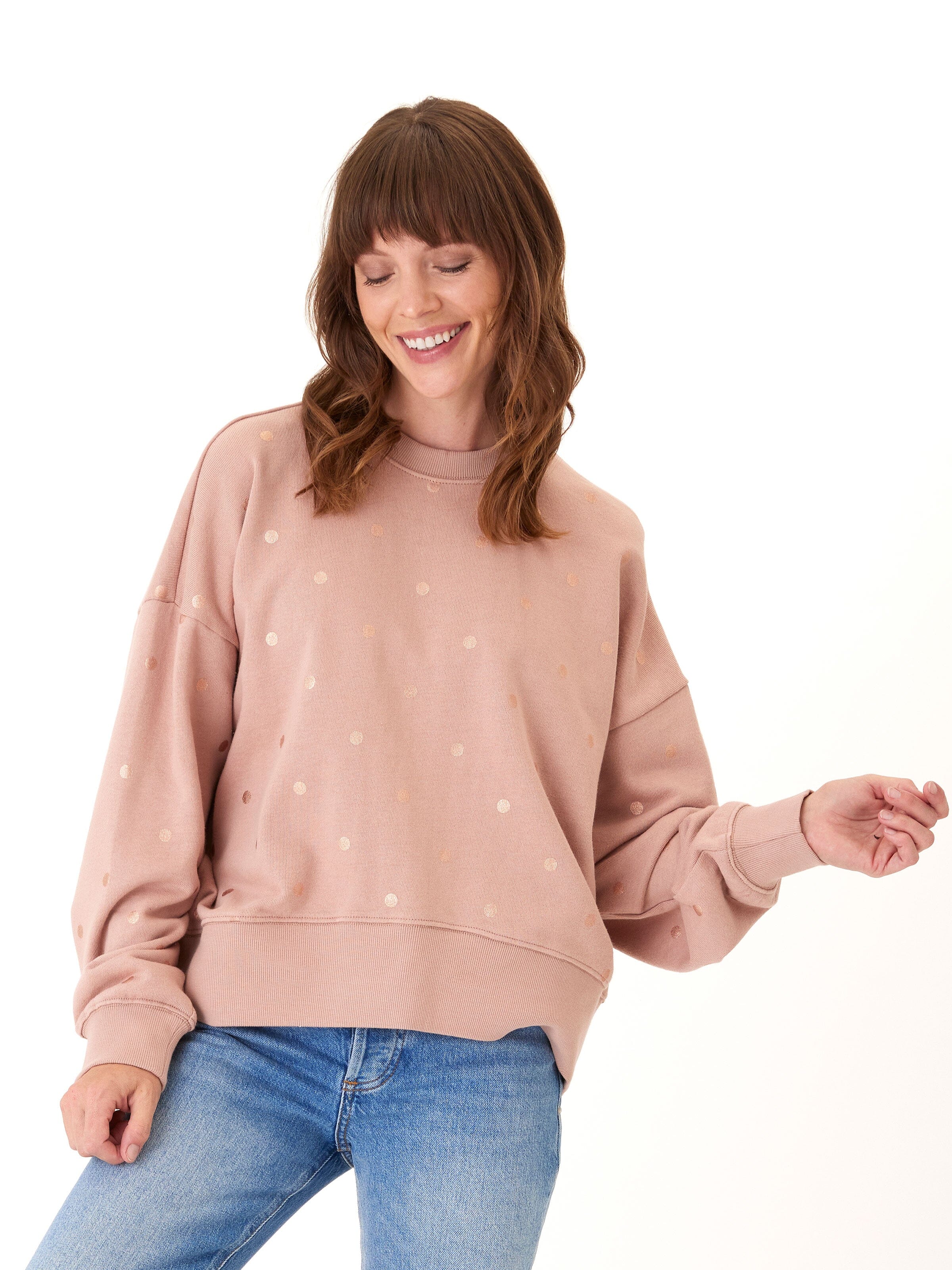 Close up of Naia Metallic Dot Pullover showing metallic dot details and ribbed trim