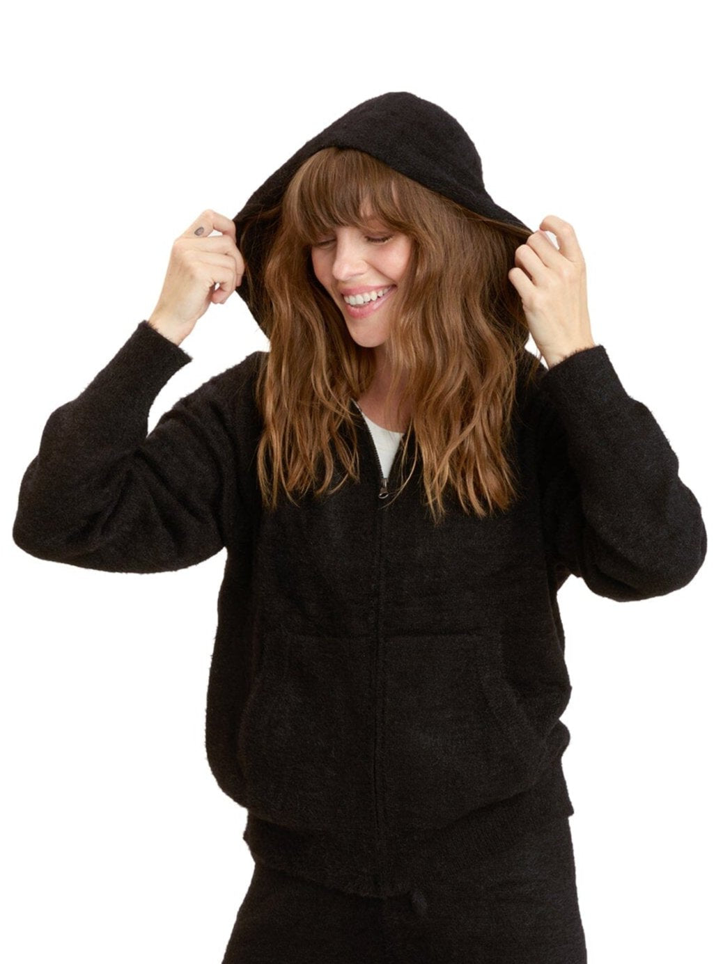 Women wearing a cozy black fuzzy knit zip-up hoodie in a relaxed loungewear style