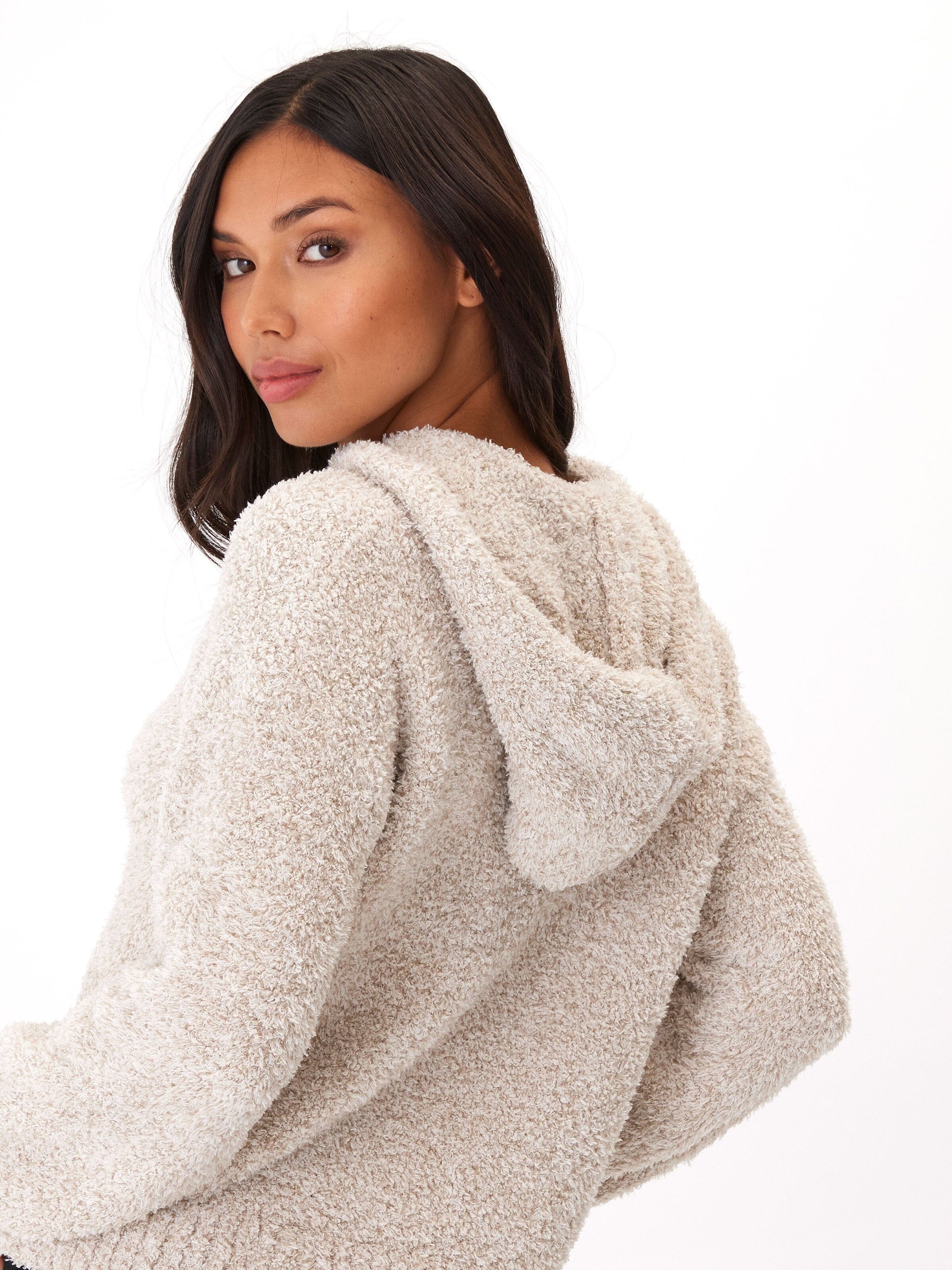 Close up of the Tanisha Boucle Henley Hoodie in cream showing the knit texture and button details.