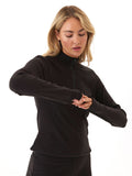 Model wearing a comfortable brushed rib 1/4 zip pullover with thumbholes in a neutral tone.