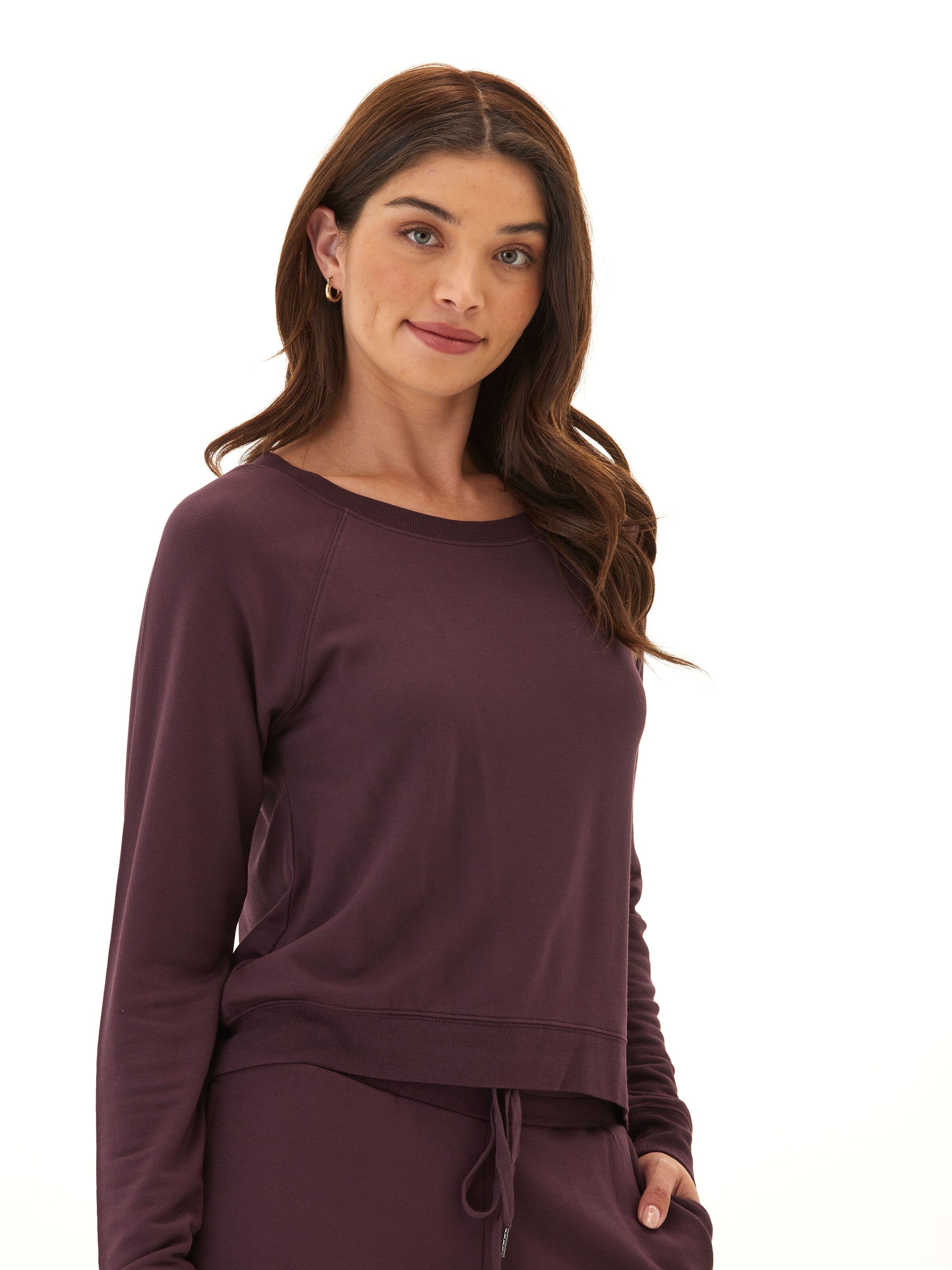 Close-up of the buttery-soft texture of the Suzanne Feather Fleece Raglan Pullover in a relaxed fit.