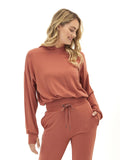 Rust colored feather fleece pullover hoodie with thumbholes and elastic waist.