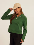 Model wearing a comfortable Tyra Triblend Fleece Quarter Zip Hoodie with thumbholes and pockets