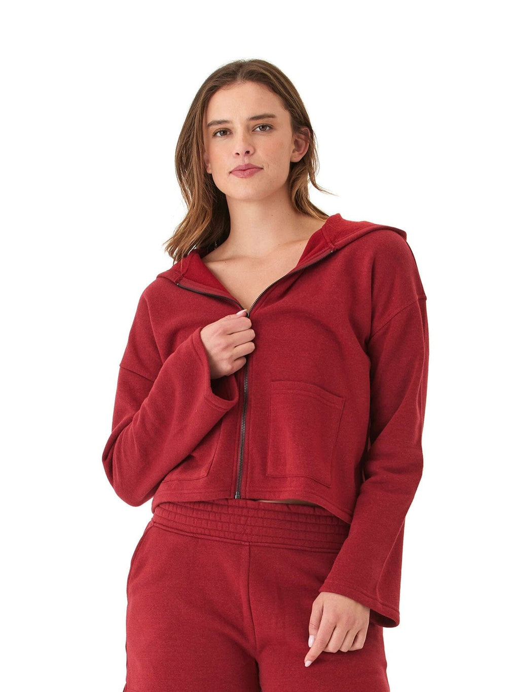 A red Raychelle triblend fleece hoodie featuring wide sleeves and two front pockets