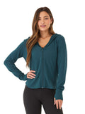 Woman wearing Ophelia Feather Fleece Zip Hoodie in Teal featuring a zip-front and thumbhole cuffs