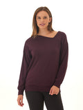 Women wearing a deep plum feather fleece asymmetrical tunic with a relaxed fit