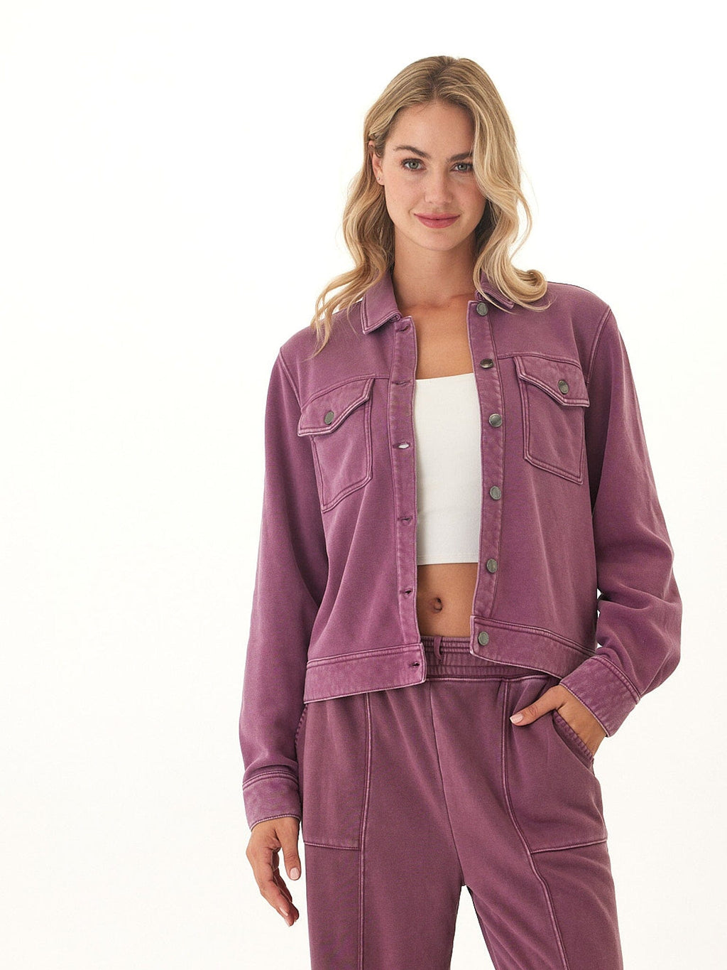 A relaxed fit, long-sleeve mineral wash plum knit jacket with a collared neckline and button-down closure.