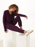Close up of Margot Feather Fleece Cargo Jogger in deep-plum, showing texture and cargo pocket detail.