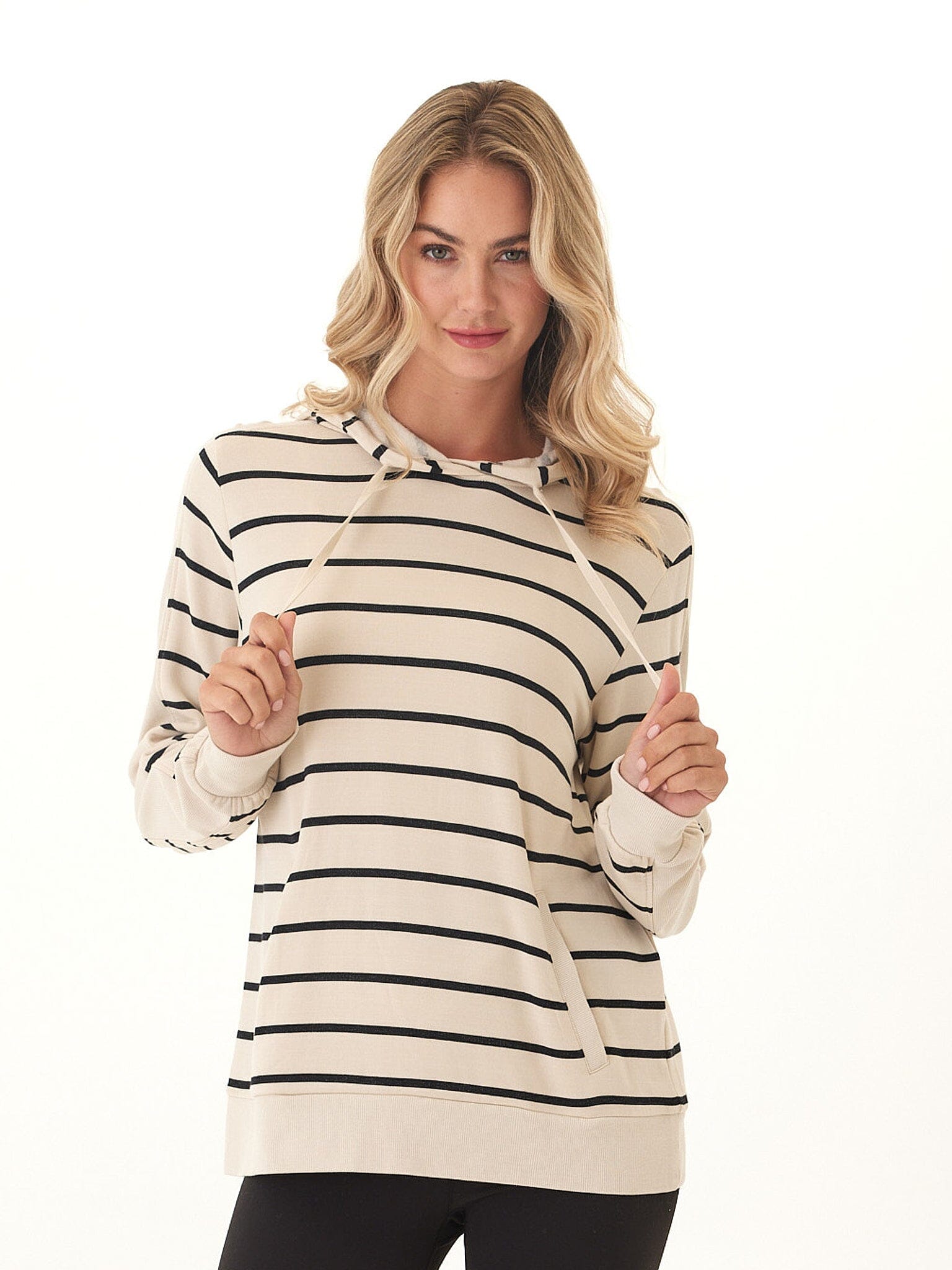 Women wearing a beige and black striped Feather Fleece rib mix hoodie with drawstring hood