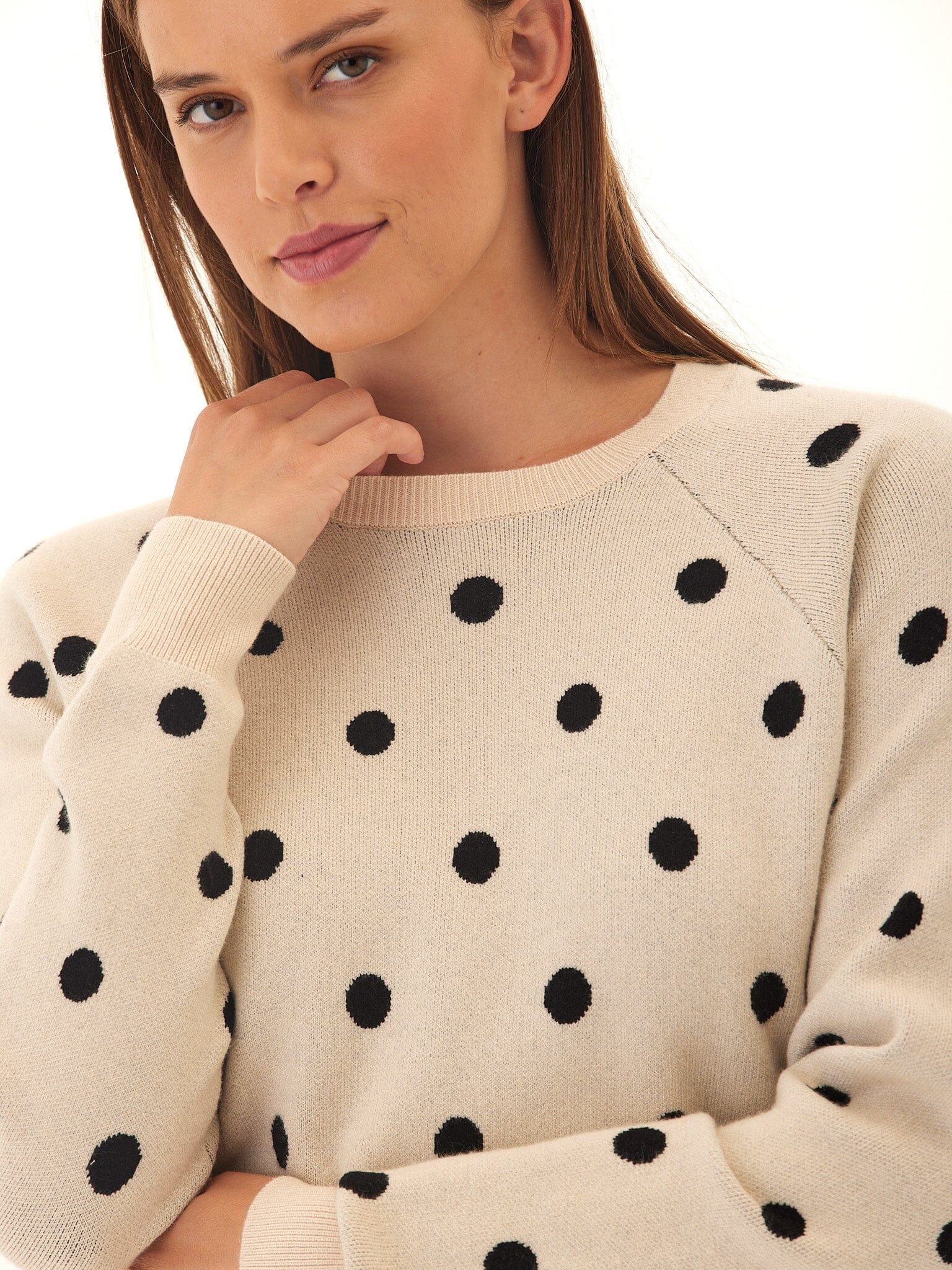Deandra Polka Dot Cozy Sweater featuring a beige base with black polka dots and crewneck design