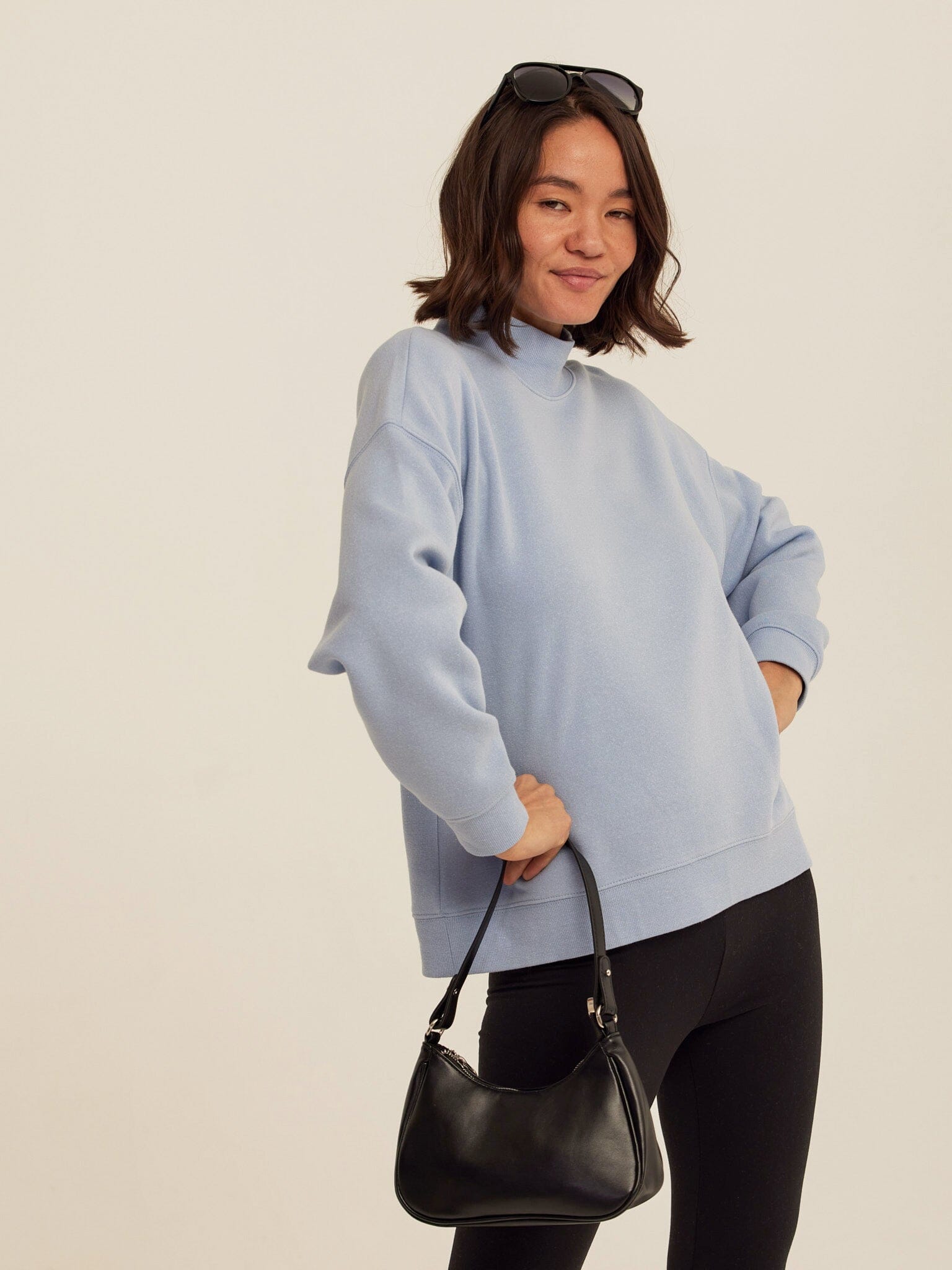 Light blue Karlie triblend fleece mock neck pullover in a soft knit fabric.