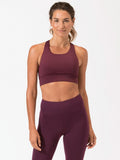 Burgundy strappy sports bra with minimalist design and double-layer front panel
