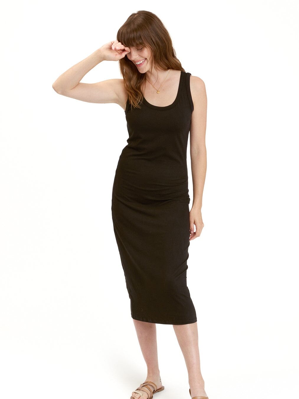 Model wearing a black Catelynn Luxe Jersey midi tank dress in a minimalist, bodycon fitted silhouette.