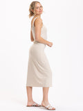 A minimalist beige midi tank dress in soft luxe jersey fabric with a classic scoop neck.
