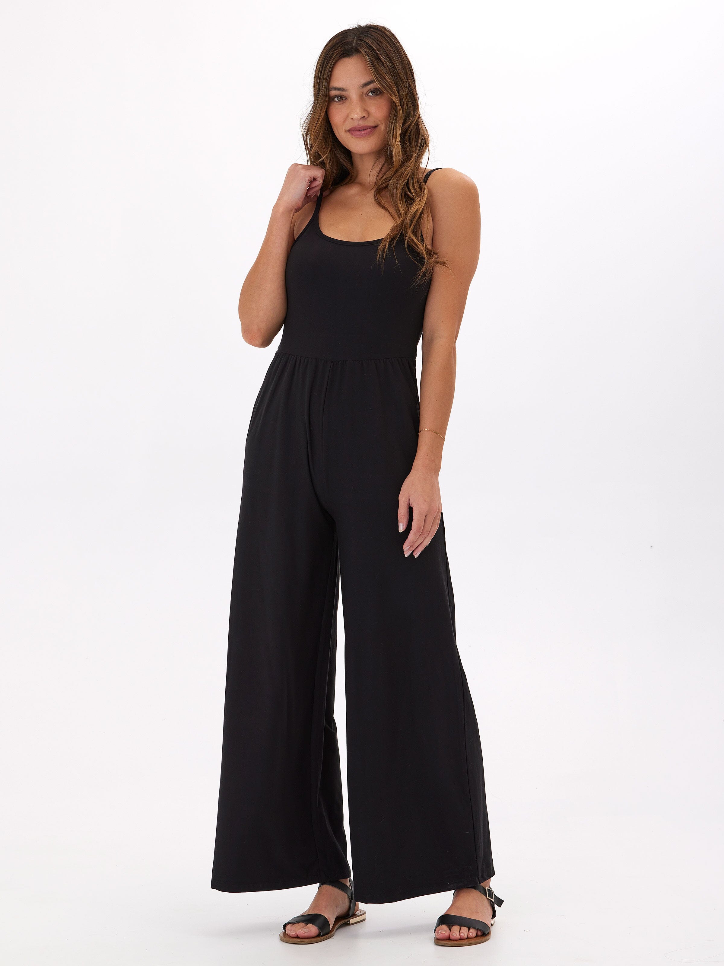 Tansie Luxe Jersey wide-leg jumpsuit in black with scoop neckline and side pockets