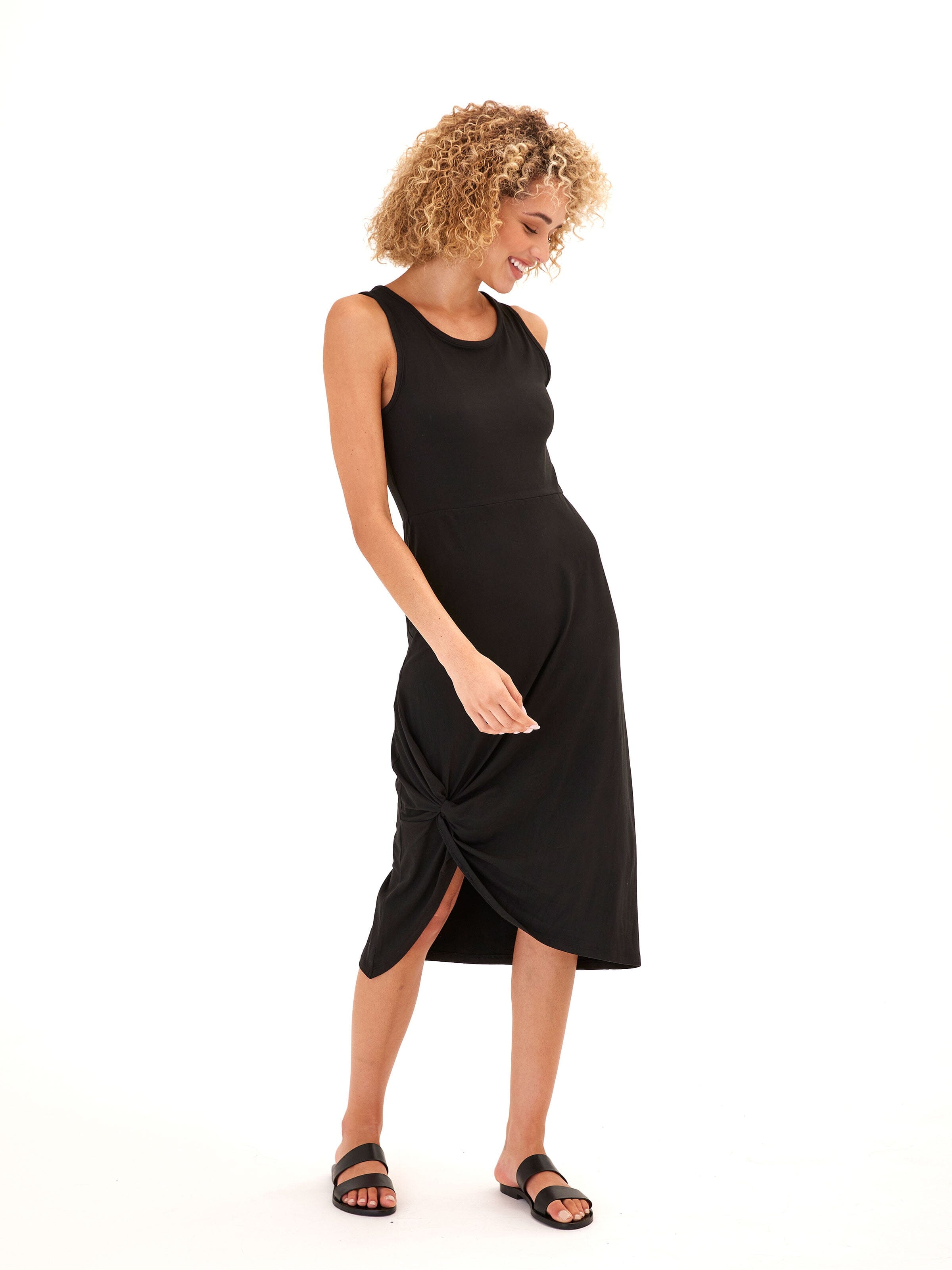 Model wearing a Lula Luxe Jersey Knotted Midi Dress featuring a flattering knot detail and stretchy fabric.