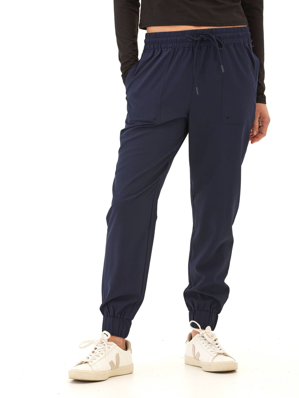 Women wearing navy blue Trysha Ultrastretch Woven Joggers with a tapered, relaxed fit.