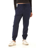 Women wearing navy blue Trysha Ultrastretch Woven Joggers with a tapered, relaxed fit.