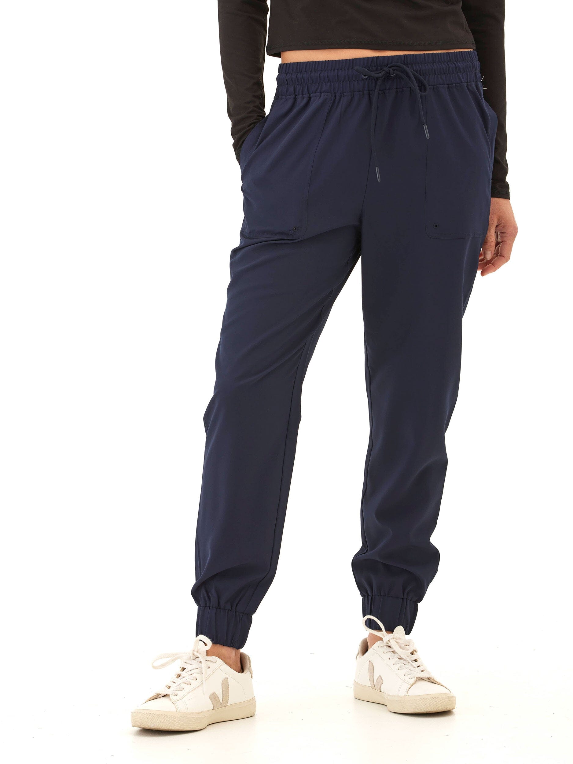 Women wearing navy blue Trysha Ultrastretch Woven Joggers with a tapered, relaxed fit.