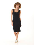Model wearing a form-fitting organic cotton rib midi dress with a square neckline and wide straps