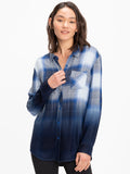 Women's oversized plaid button-up shirt in navy, blue, and white colors