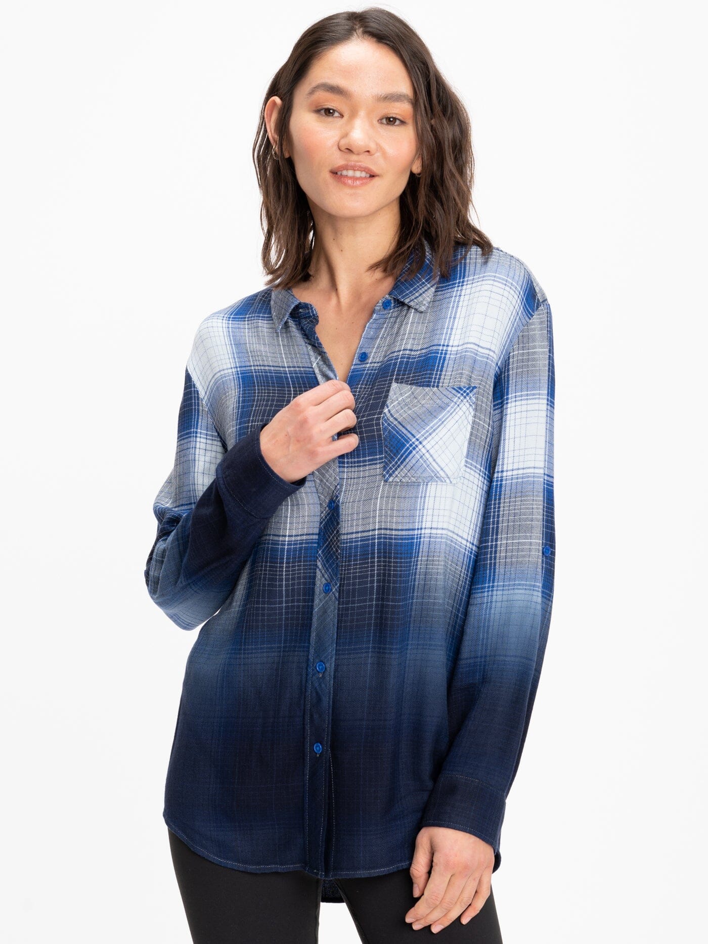Women's oversized plaid button-up shirt in navy, blue, and white colors