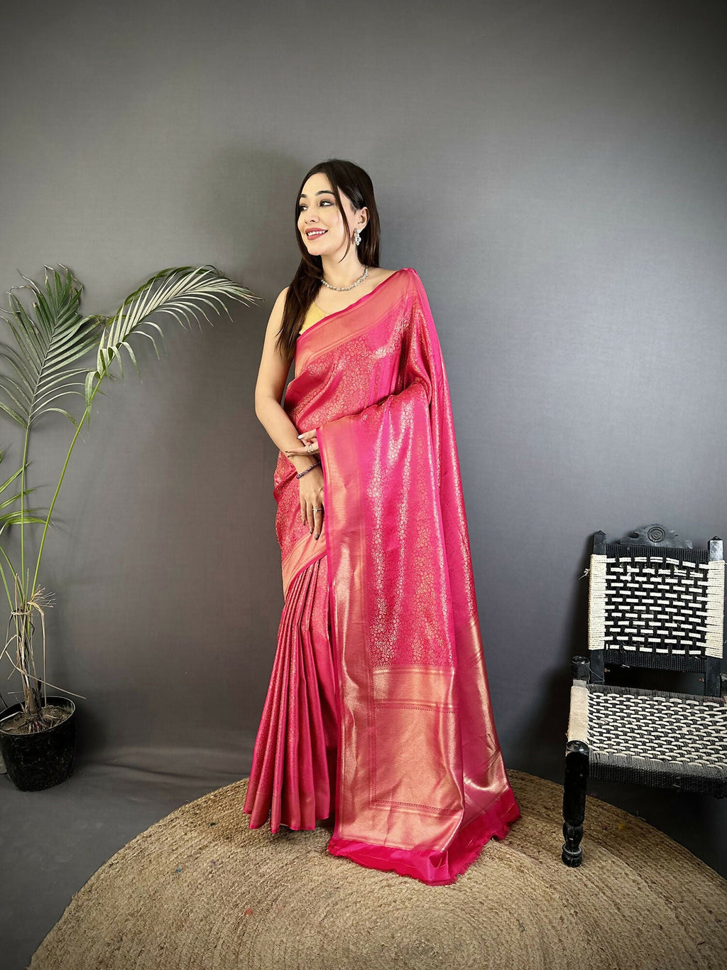 Pink satin silk Kanchipuram saree with floral and ethnic motifs