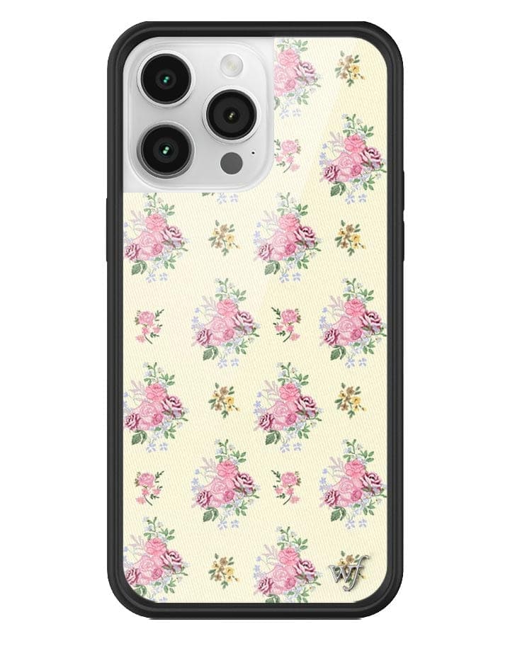 Vintage Floral iPhone case with pink and multi-colored flower bouquets on a soft yellow background and a black protective bumper.