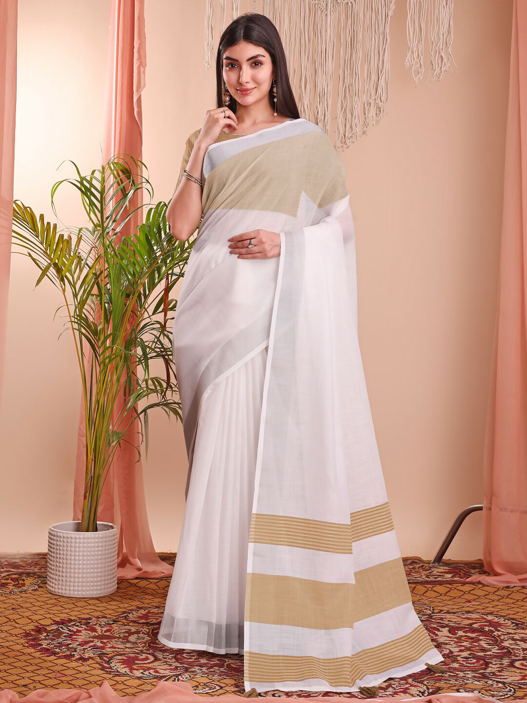 Beautiful white linen cotton saree with matching blouse piece draped elegantly.