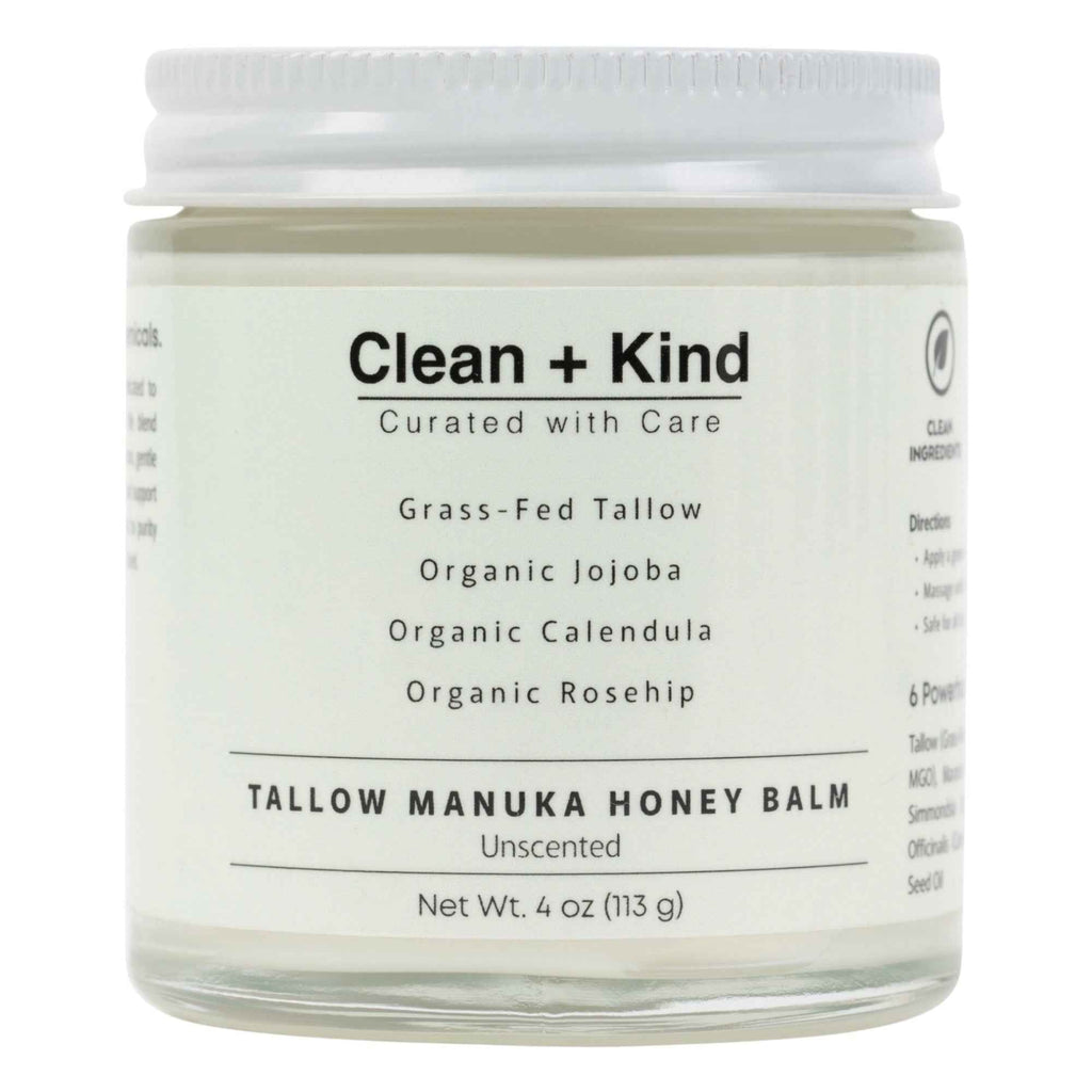 Close up of a glass jar of Whipped Tallow Manuka Honey Balm held in a hand