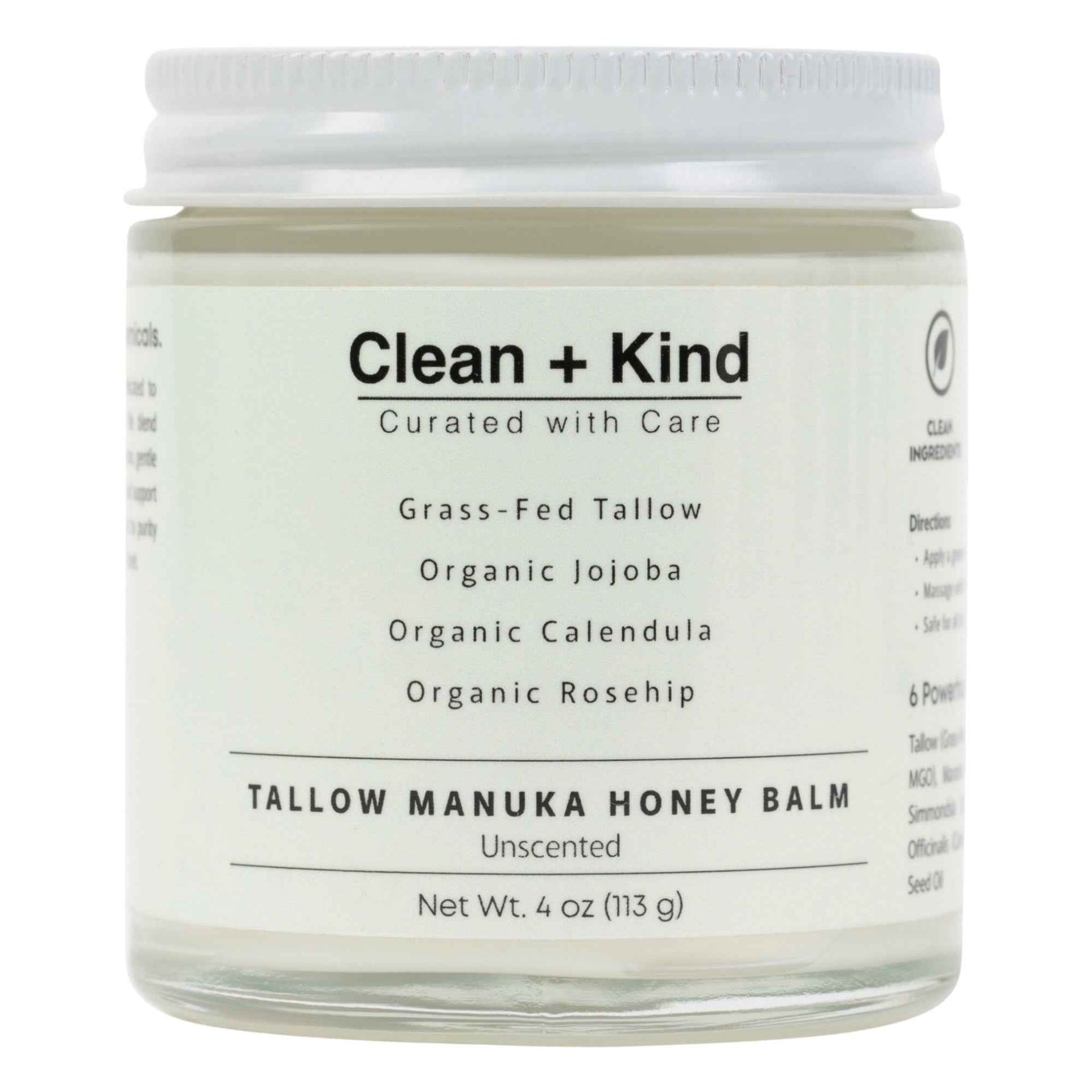 Close up of a glass jar of Whipped Tallow Manuka Honey Balm held in a hand