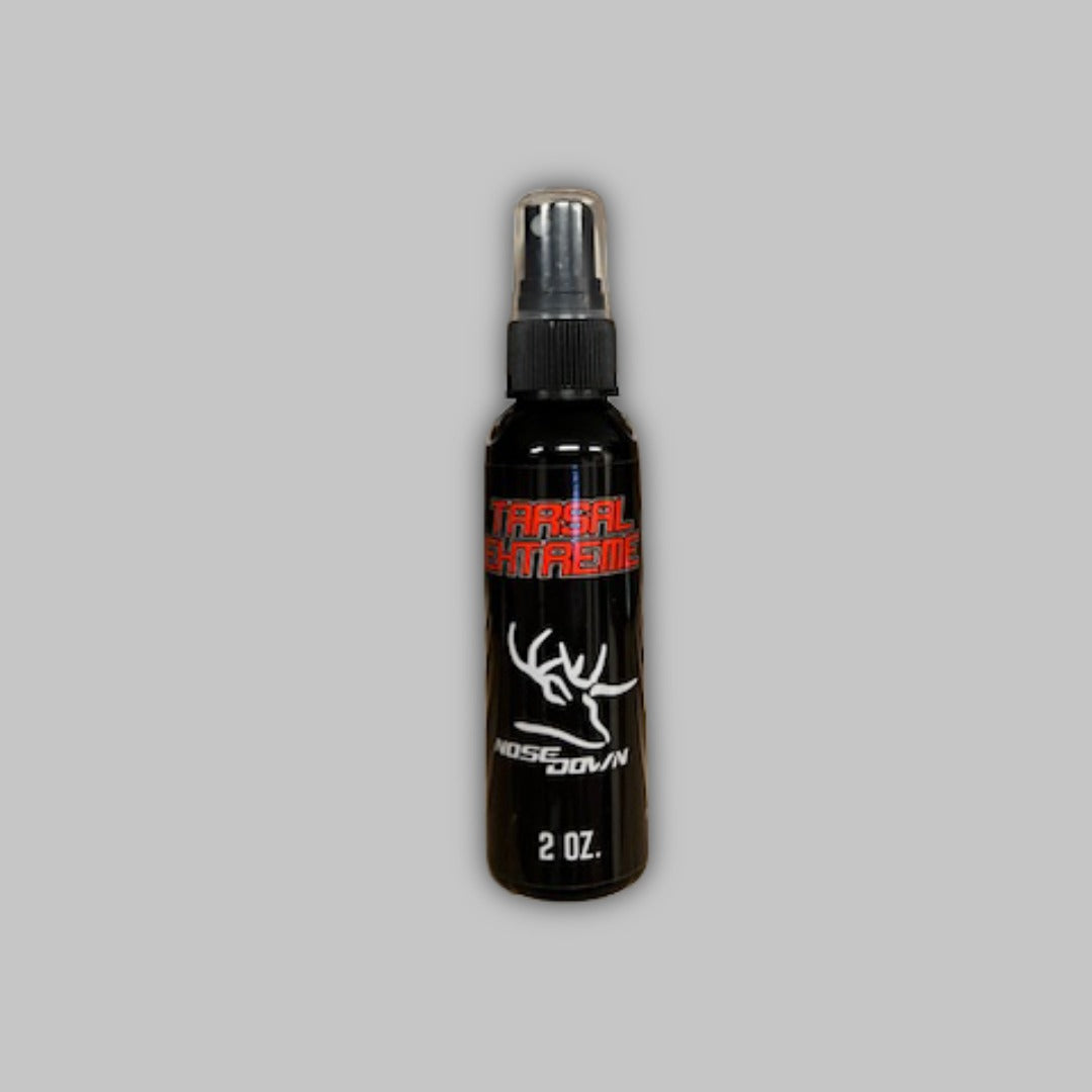 Tarsal Extreme 2oz synthetic deer scent spray bottle with black, red, and white branding.