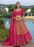 Elegant pink silk lehenga choli with intricate hand-work embroidery and lacework dupatta for wedding wear