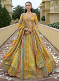 Multicolor silk lehenga choli with intricate badla and thread embroidery for wedding wear