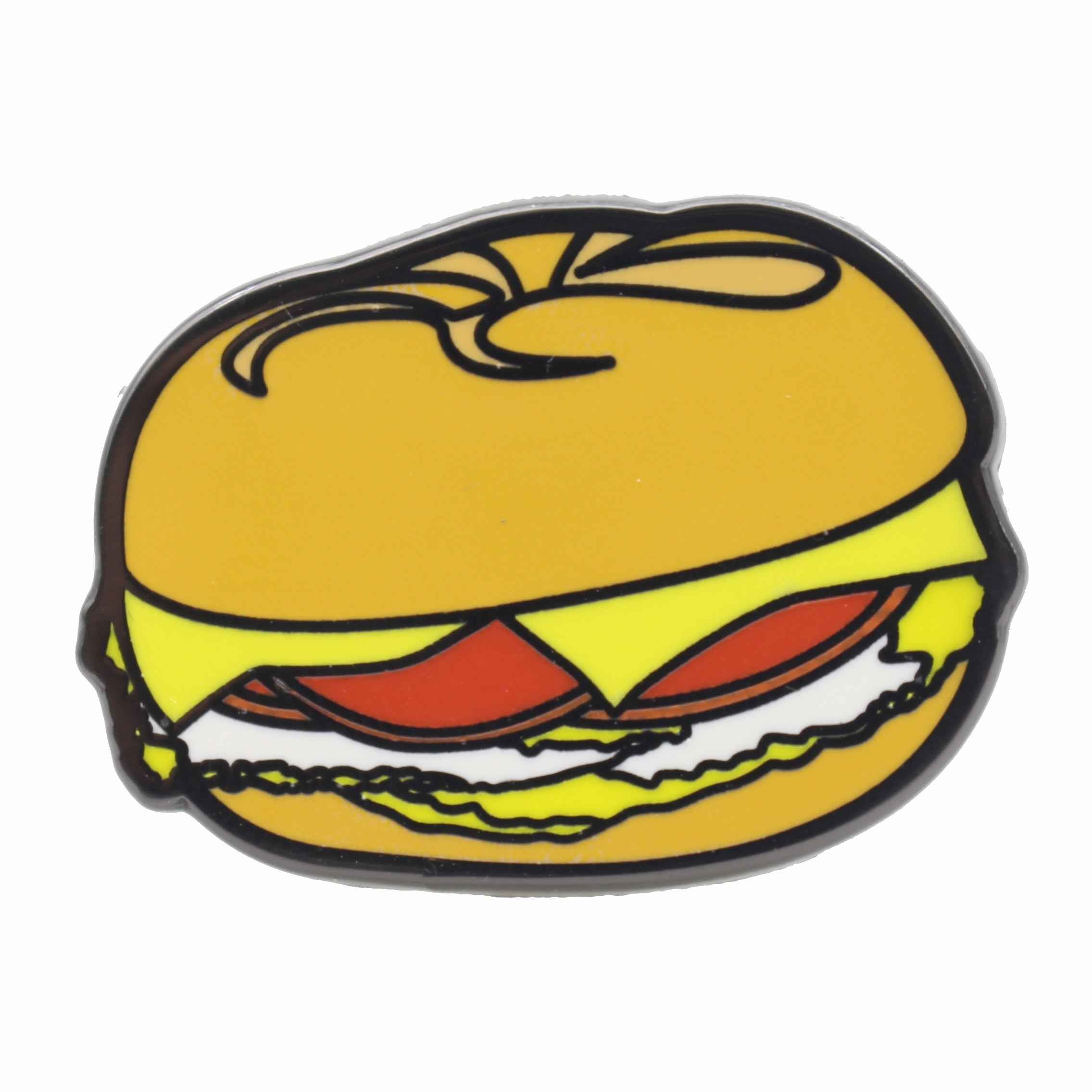 A small enamel pin featuring a Taylor pork roll, egg, and cheese sandwich on a metal backing.