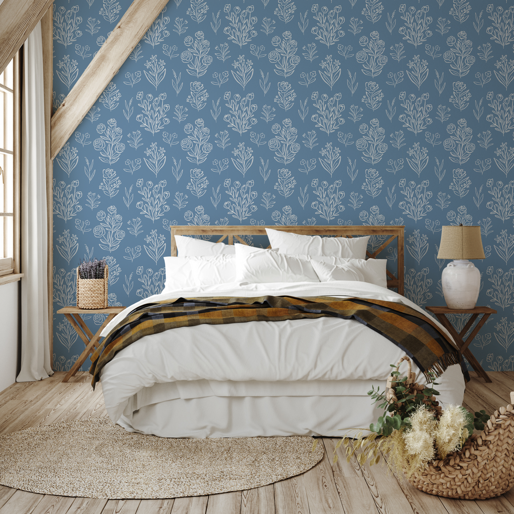Taylor floral wallpaper in blue, white, peach, and beige, showcasing a bohemian cottagecore aesthetic.