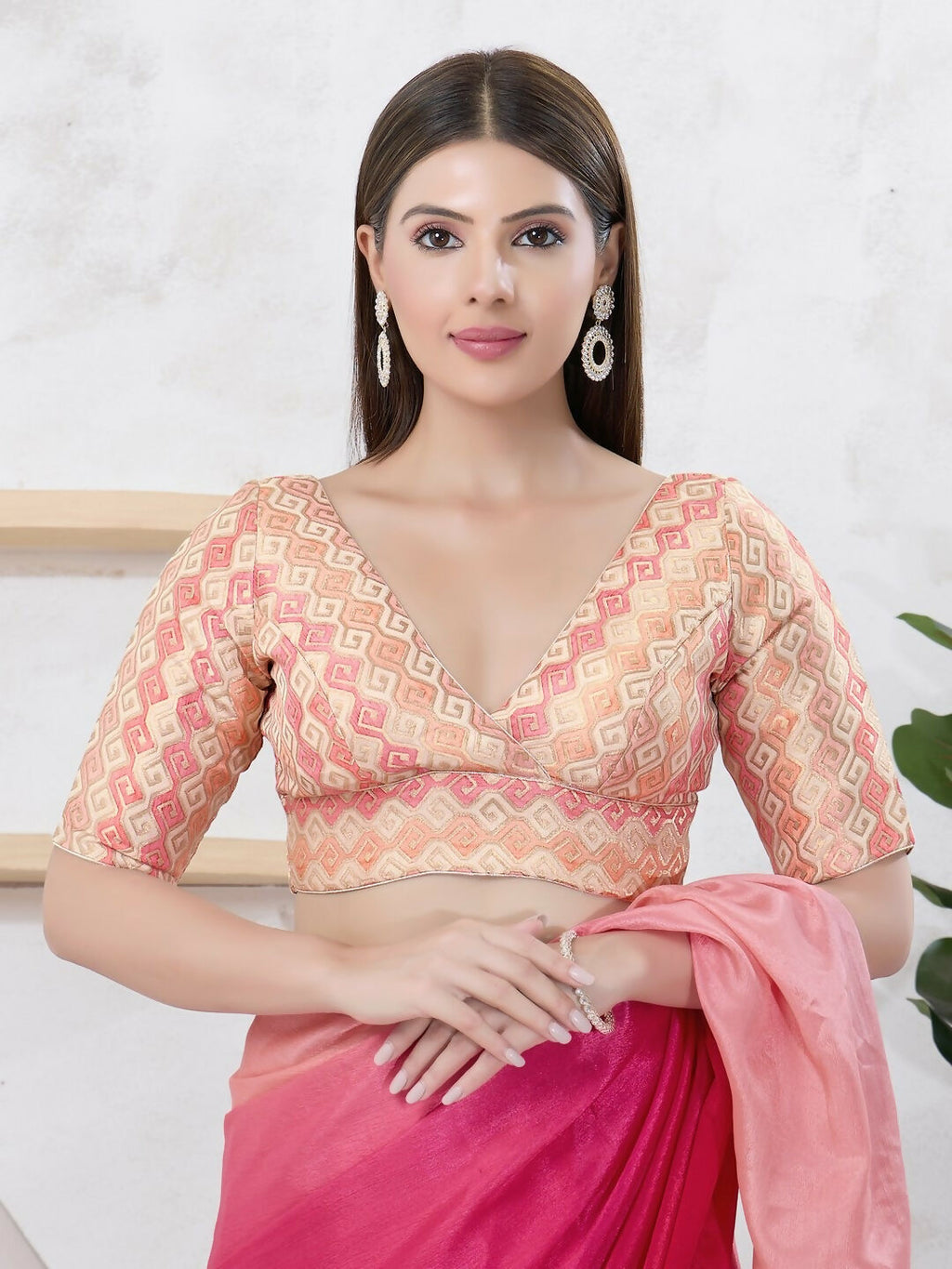 Gold brocade blouse with V-neck, elbow-length sleeves, and back-open style.