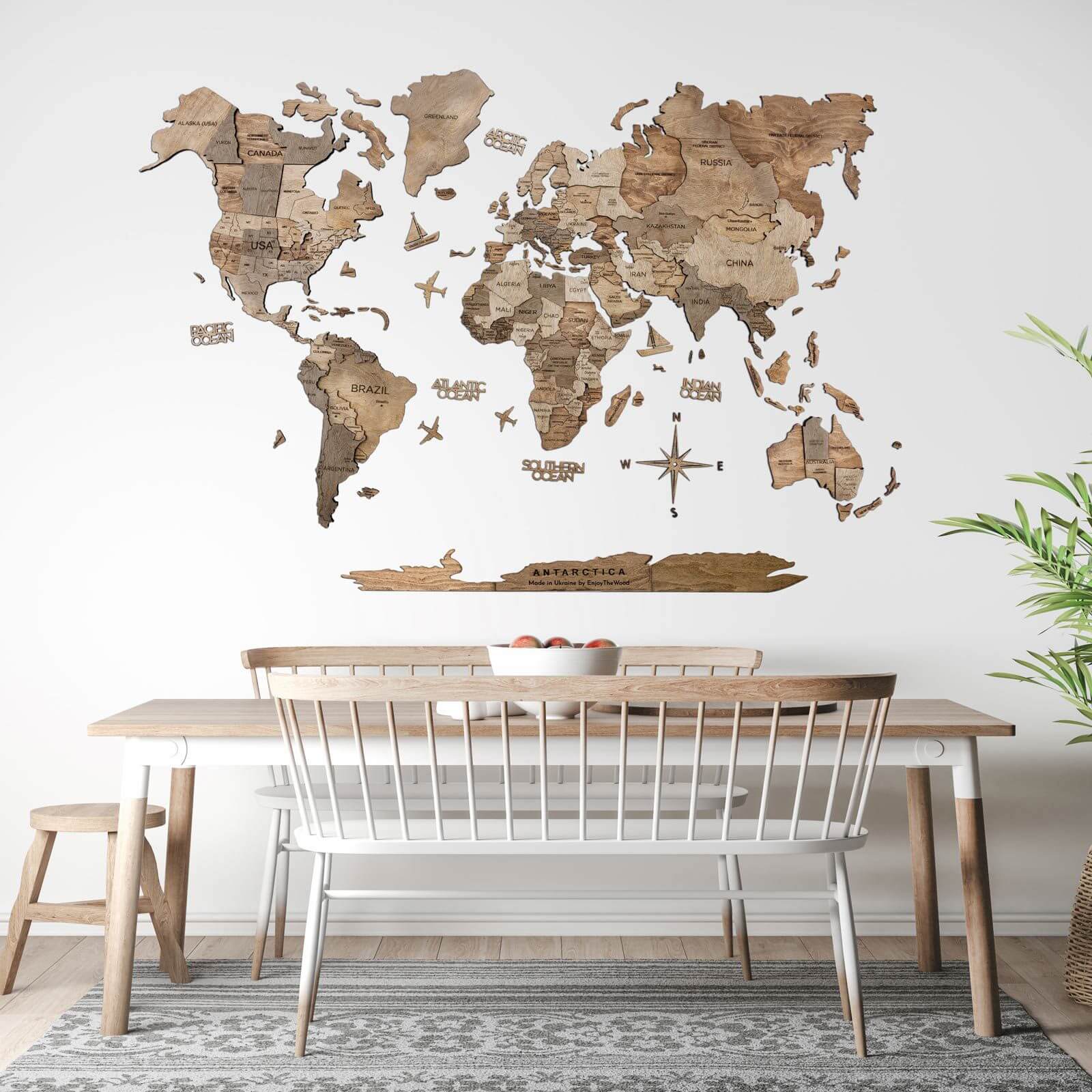 3D wooden world map in brown and tan tones mounted on a wall