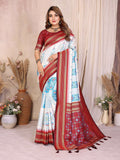 White soft silk saree with intricate weaving patterns and elegant drape