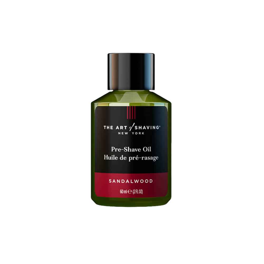 The Art of Shaving Sandalwood Pre-Shave Oil bottle in green, black, and red packaging.