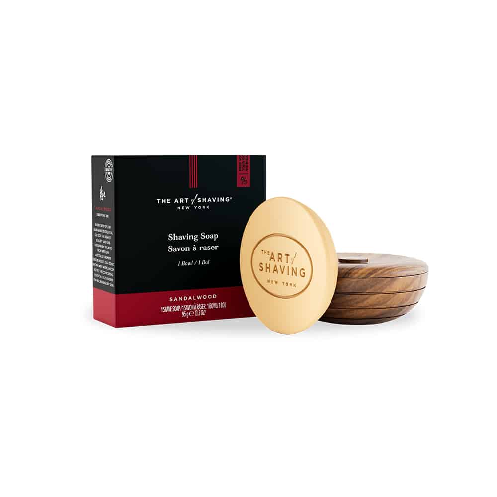The Art of Shaving Sandalwood soap inside a circular teak wood bowl