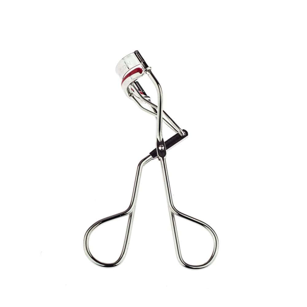 Kevyn Aucoin silver eyelash curler with red accents.