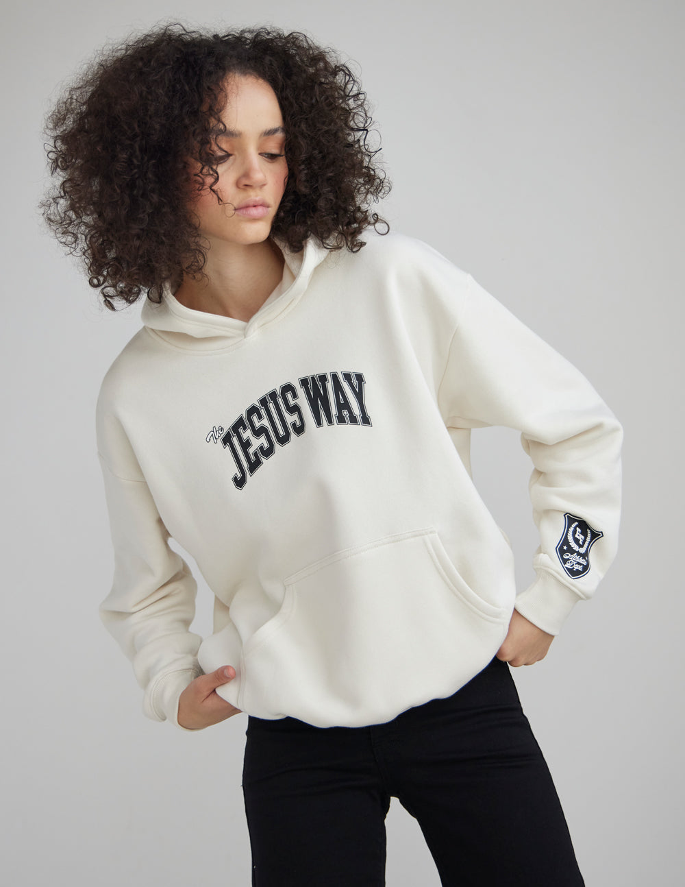 The Jesus Way Unisex Hoodie in white down with navy blue athletic text and patches