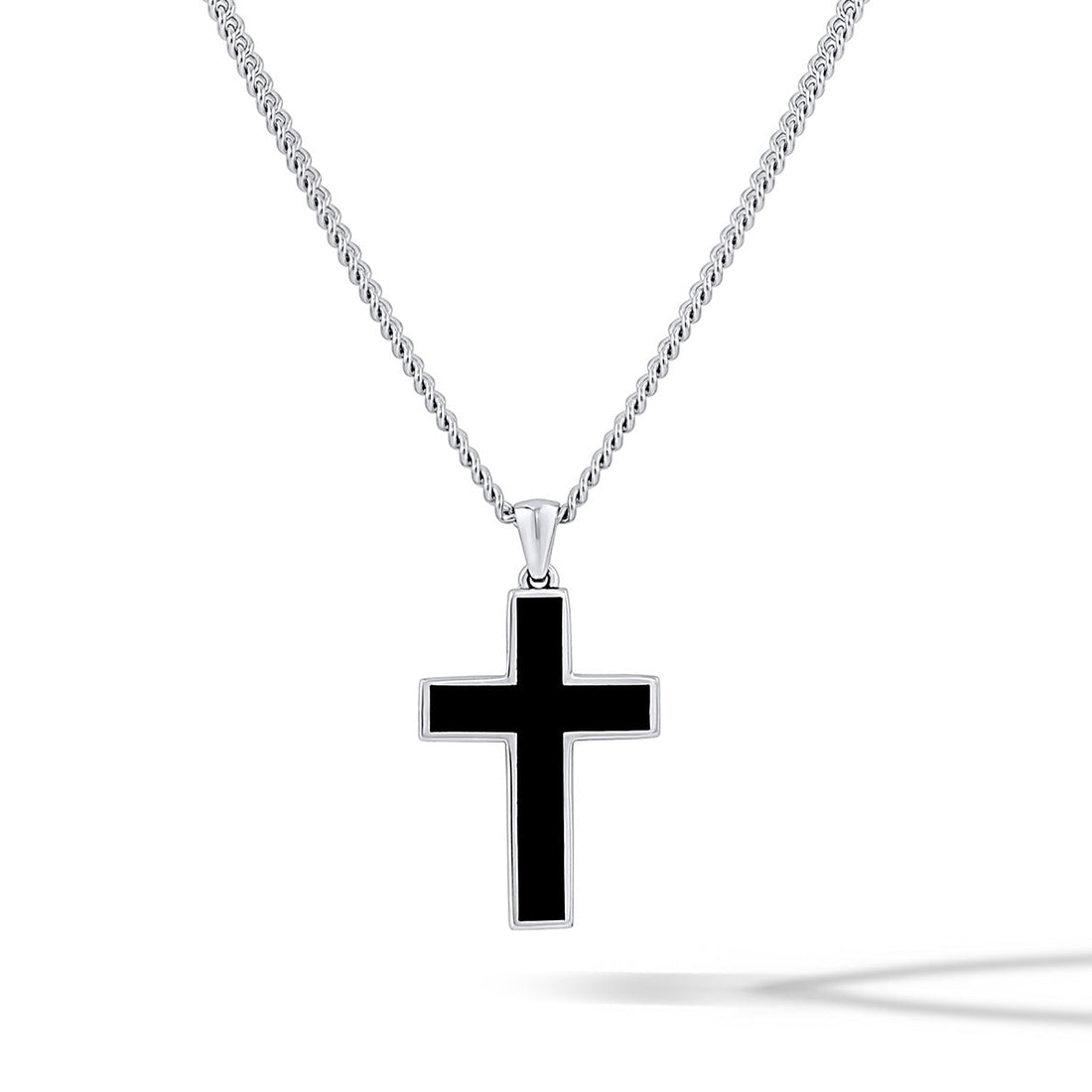 Black Onyx Stone Cross Pendant featuring sharp silver lines worn as a minimalist necklace.