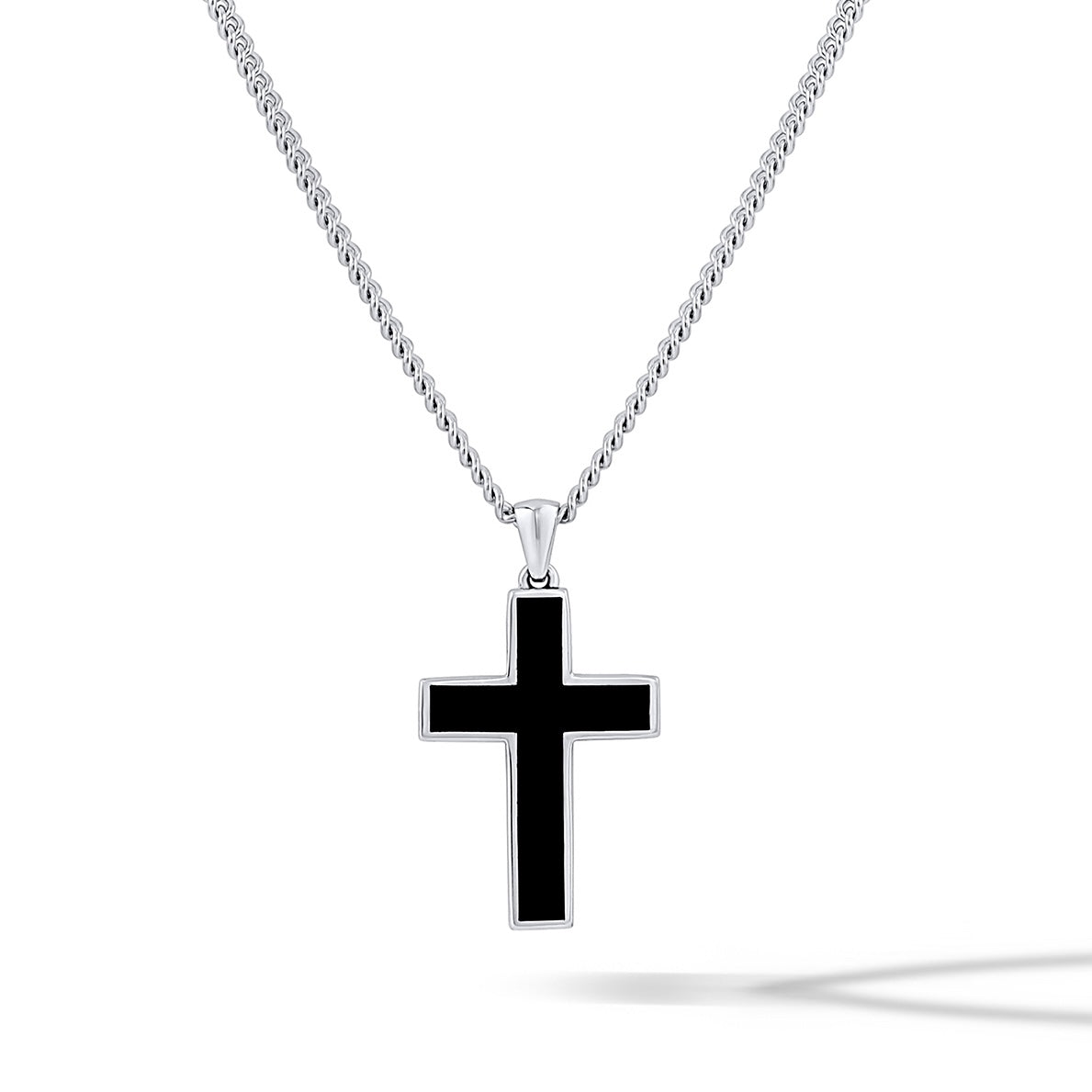 Black Onyx Stone Cross Pendant featuring sharp silver lines worn as a minimalist necklace.