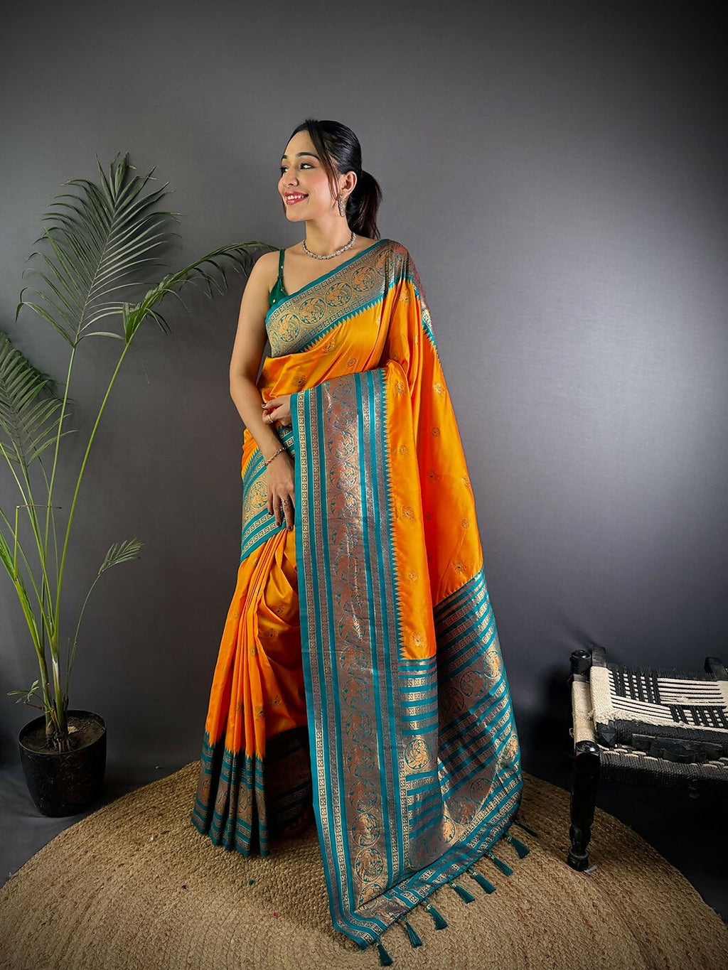 Vibrant Orange Banarasi Woven Soft Silk Saree with traditional woven patterns.