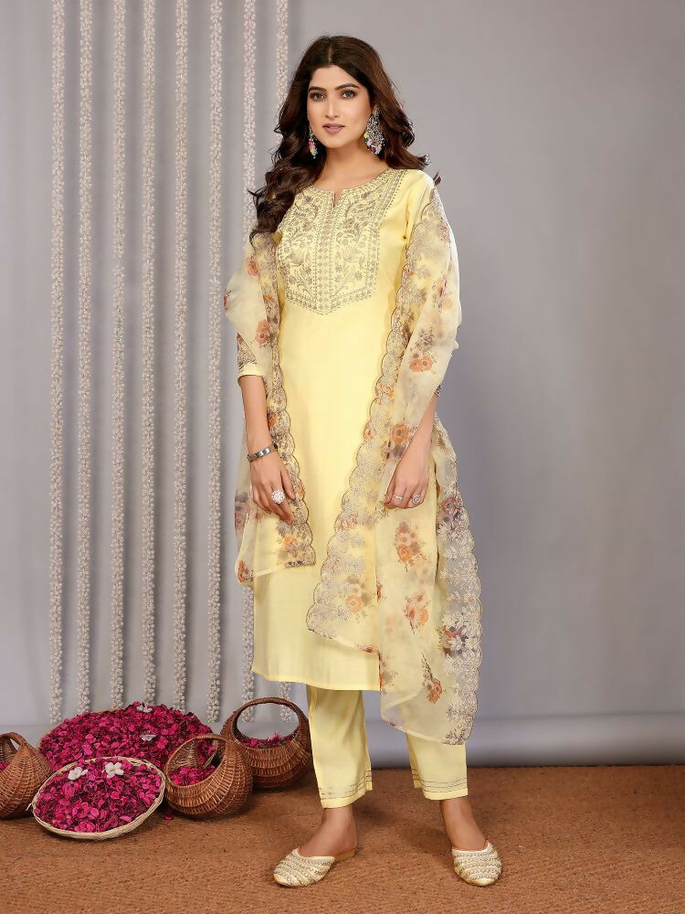Pale yellow kurta with delicate roman embroidery and three-quarter sleeves.