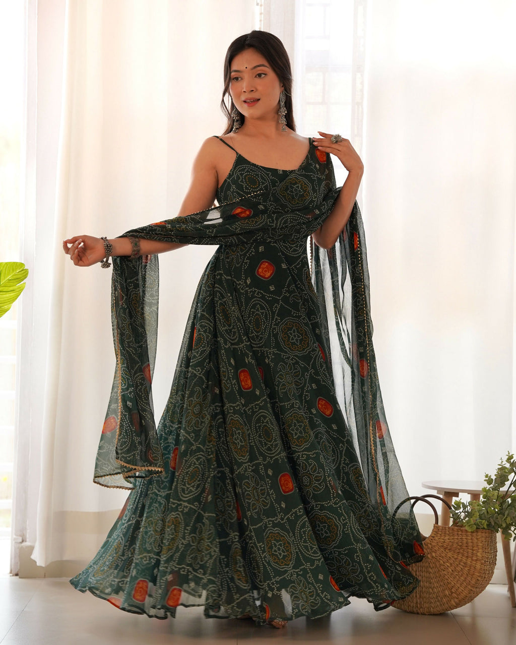 Bottle green chiffon kurta with intricate sequin embroidery and sheer fabric detail