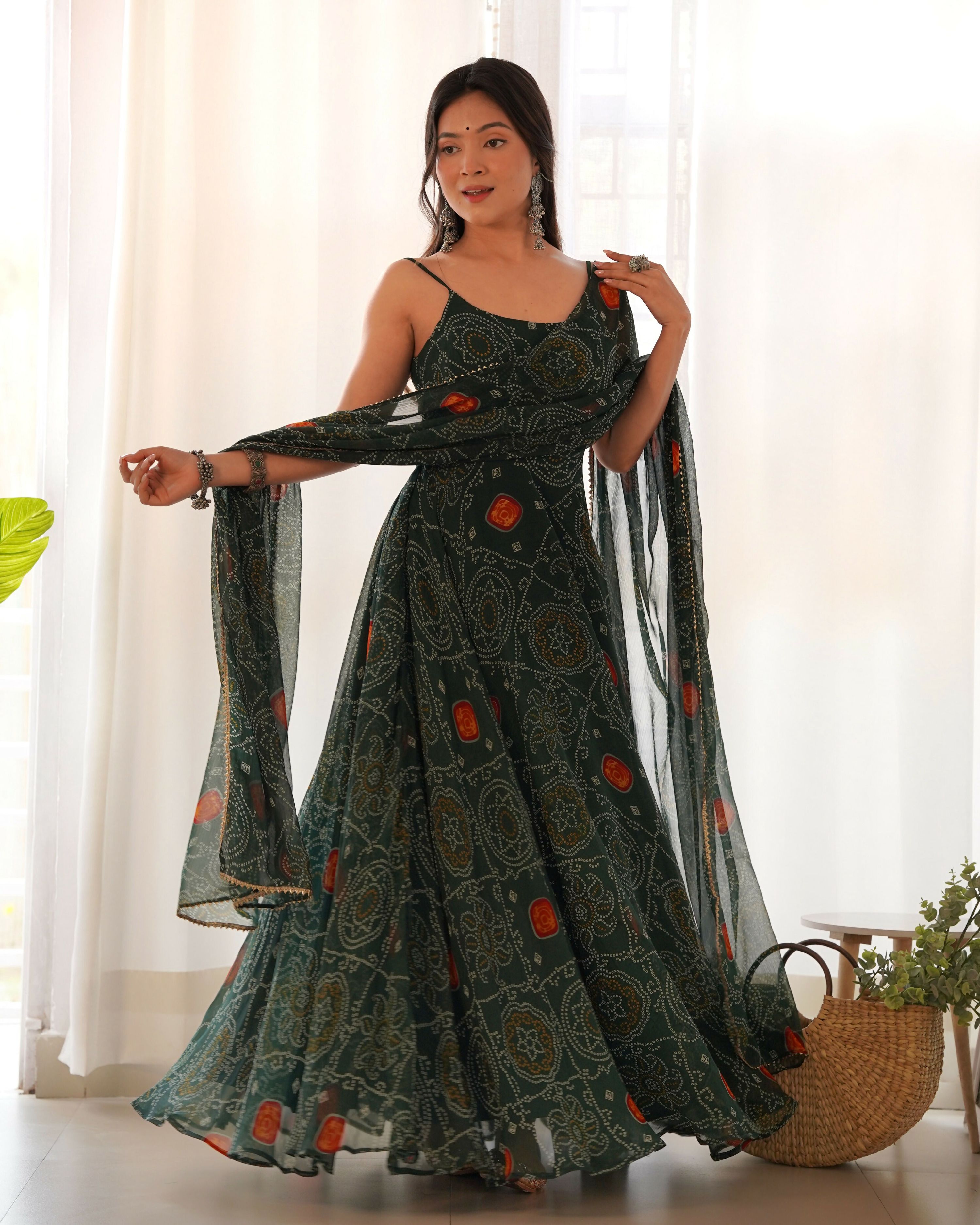 Bottle green chiffon kurta with intricate sequin embroidery and sheer fabric detail